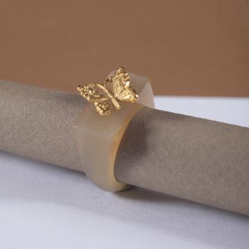 Butterfly ring in horn
