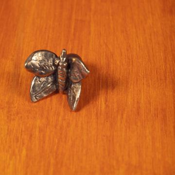 Bouton de porte Papillon en métal patiné