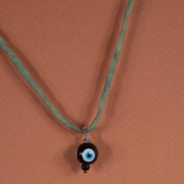 Charm in spun glass and turquoise, black, eye