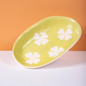 Cover dish in stamped earthenware, apple green, oval [1]