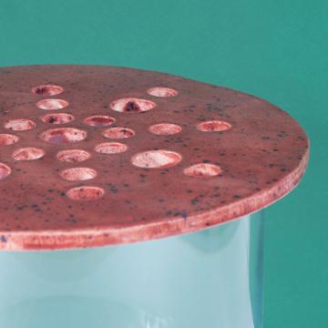 Flower pic disc in earthenware , dark red, 21 cm diam. [2]