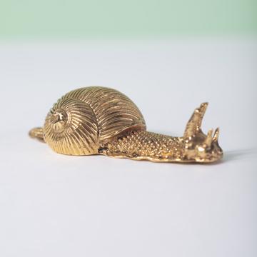 Snail knife rest in casted metal, gold [1]